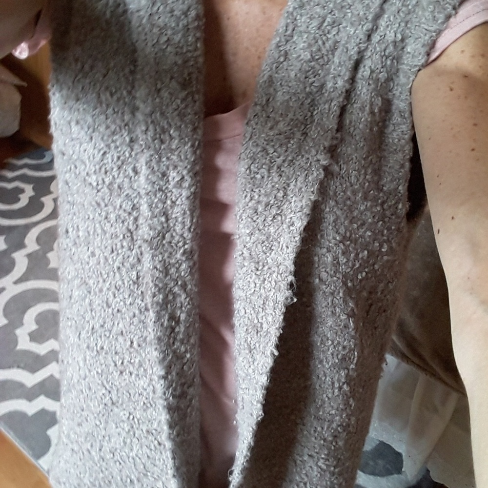 Woman's long sleeveless sweater